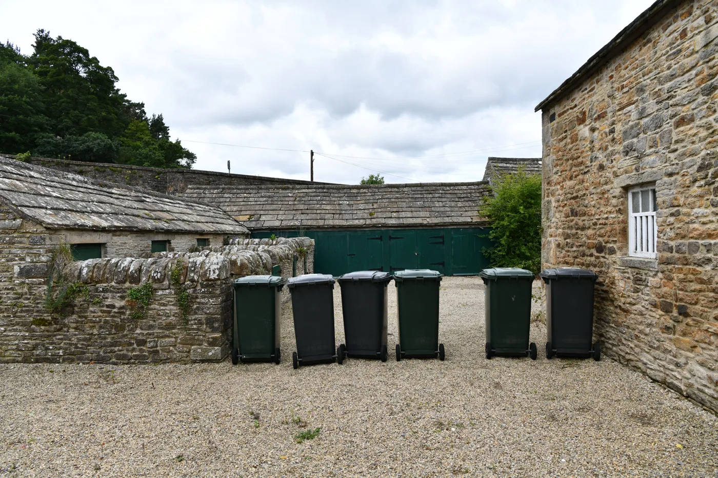 Wheelie bins lined up at Blanchland in west Northumberland. The county runs two kerbside bins, not four.